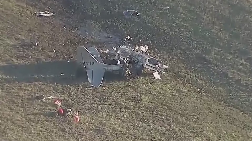Historic military planes collide in mid-air crash at Dallas Executive Airport